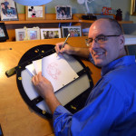 Tom Bancroft at his art desk